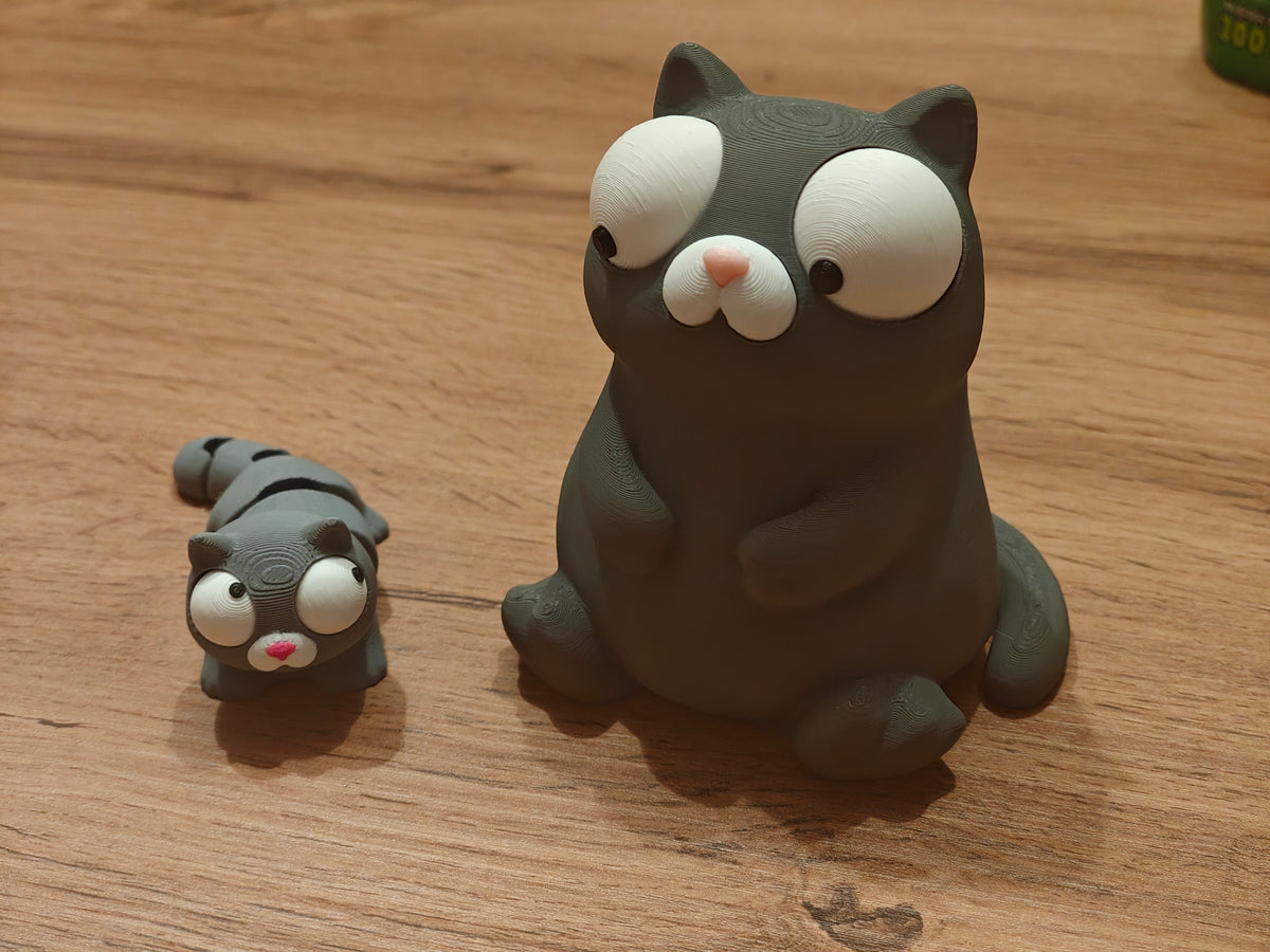 Mini Goofy Cat – flexibel kattenfiguurtje met wiebeloogjes, close-up op witte achtergrond
