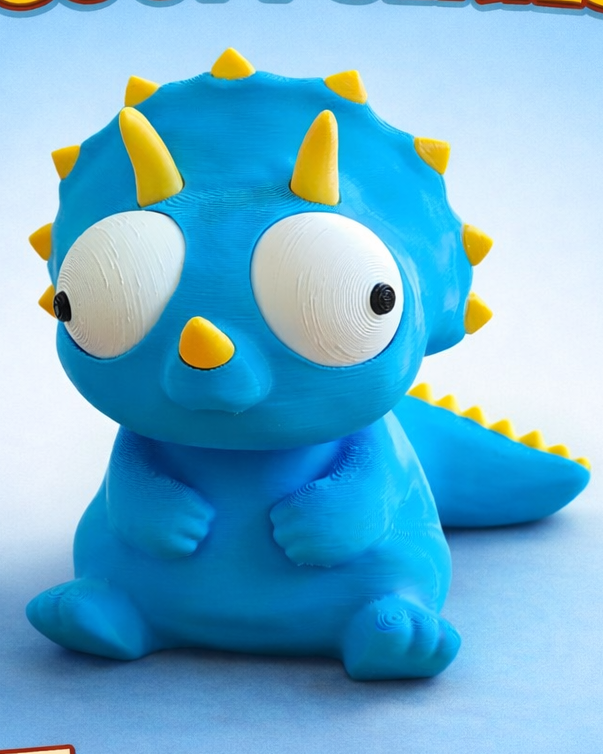 Gek triceratopsfiguurtje met beweegbare ogen, close-up op witte achtergrond