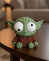 Gek Yoda-figuurtje met beweegbare ogen en grote oren, van voren gezien