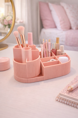 Roze geribbelde cosmetica-organizer met meerdere vakken, vooraanzicht