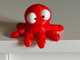 Detail van gelede tentakels en grote beweegbare ogen op mini flexi-octopus