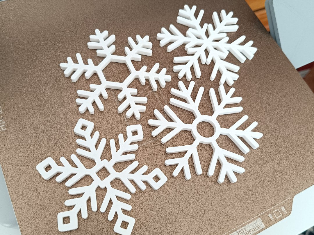 Set van 4 onderzetters in de vorm van sneeuwvlokken