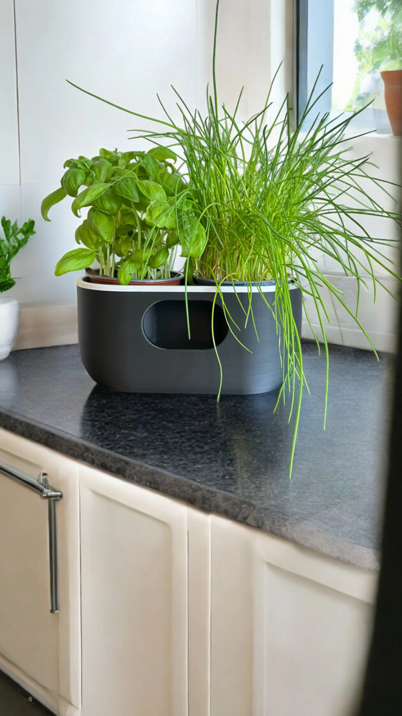 Ovale witte zelfwaterende pot met strak minimalistisch profiel