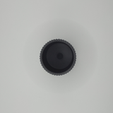 Verfijnd geribbeld oppervlak van een minimalistische pennenhouder in het licht