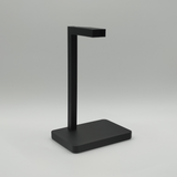 Minimalistische koptelefoonstandaard met gamingheadset op een modern bureau