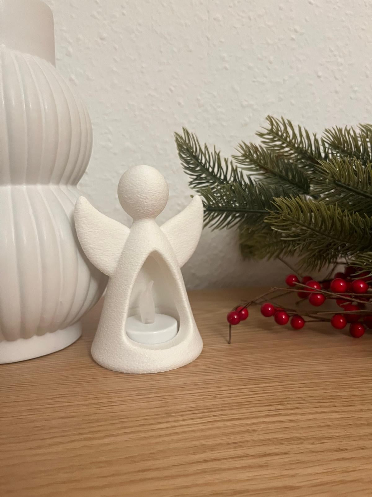 Engelenfiguur met led-theelichtje dat van binnenuit schijnt