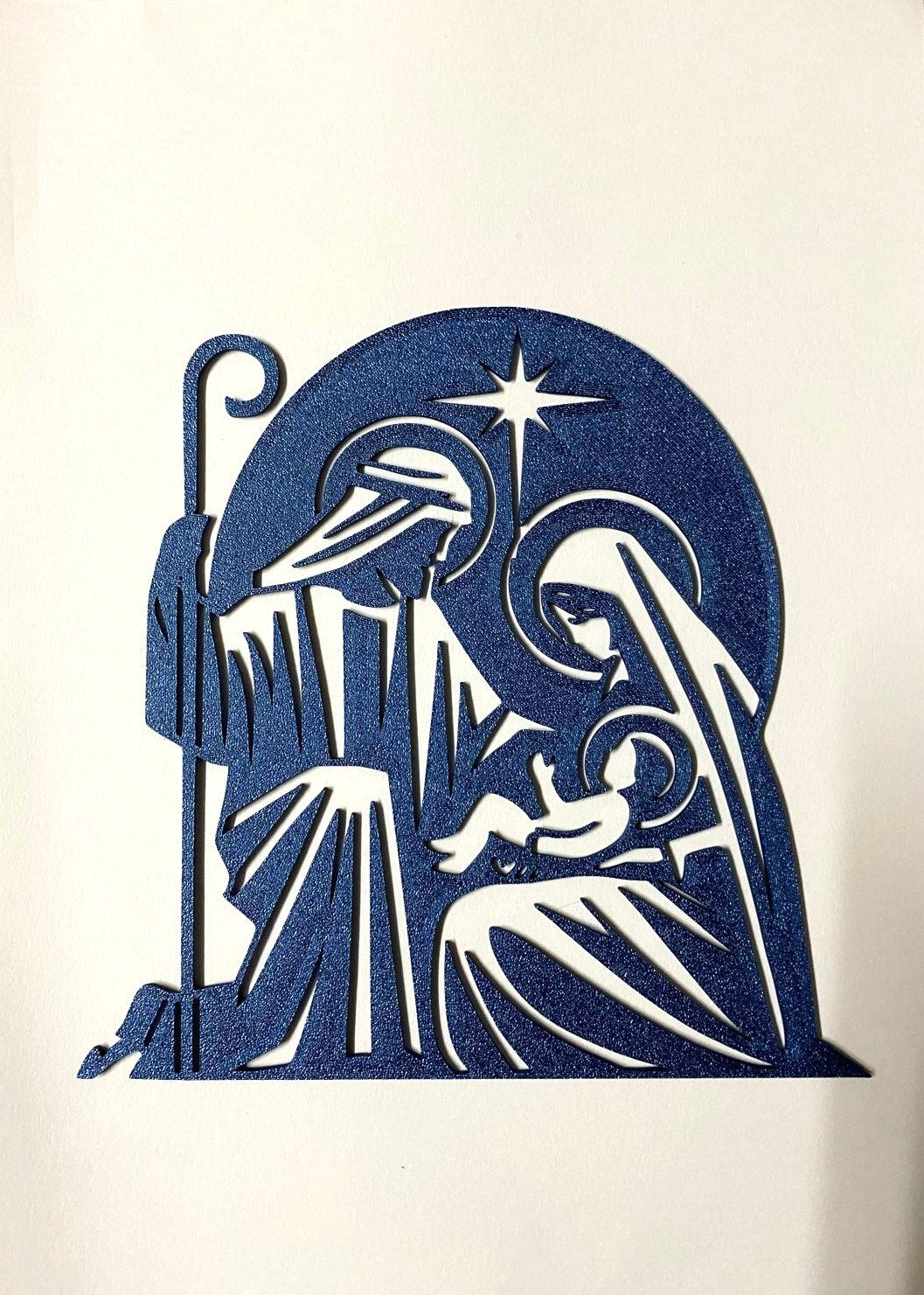 Kerststal als silhouet met Jozef, Maria, het kindje Jezus en ster