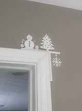 Kerstdecoratie voor de hoek van een deurpost