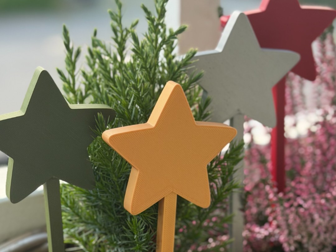 Kerstster op stokje voor in de bloempot