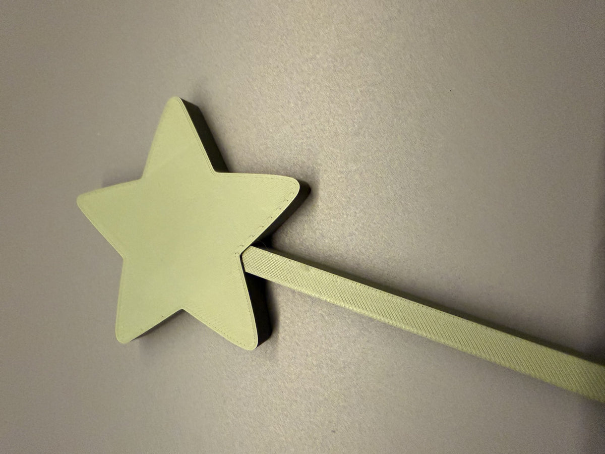 Kerstster op stokje voor in de bloempot