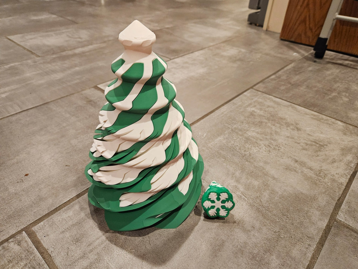 Spiraalvormige kerstboom-fidget in de vorm van sneeuwvlok en kerstboom