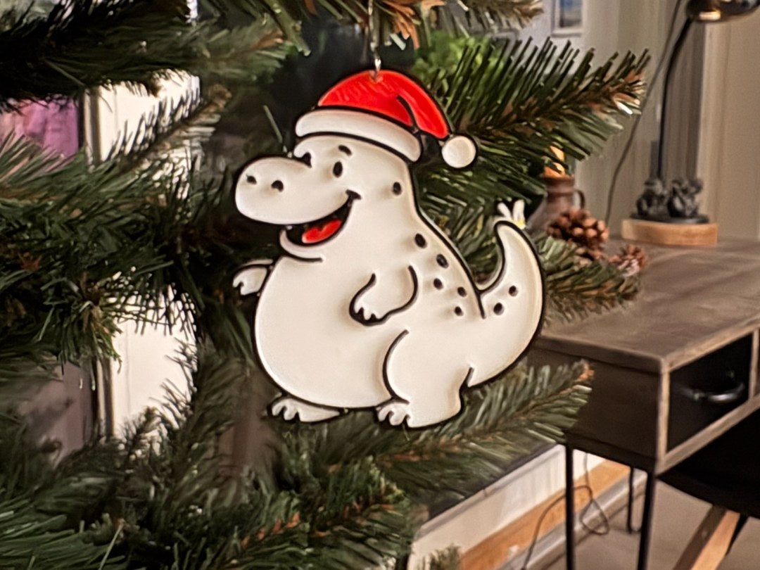 Klein dinosaurusje als kerstboomversiering