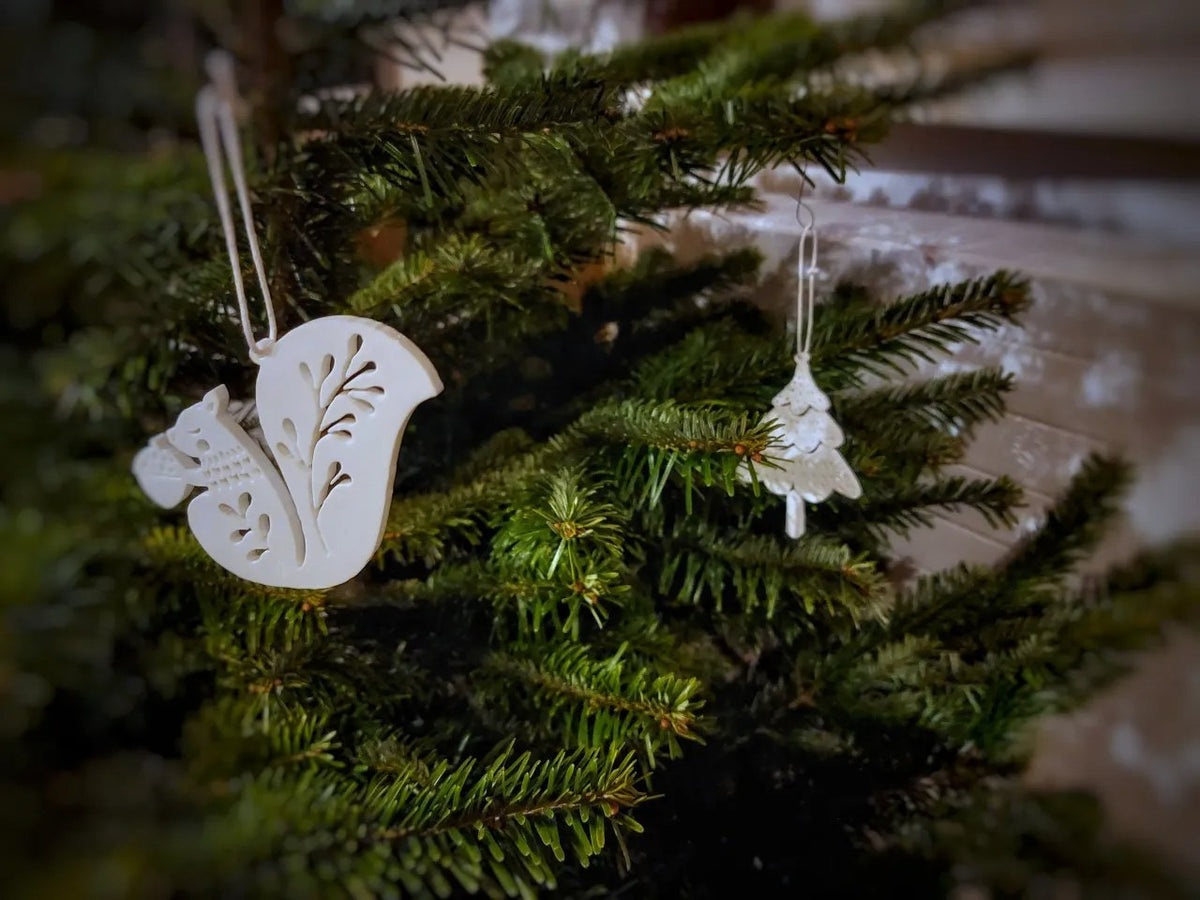 Acht kerstboomversieringen in de vorm van dieren
