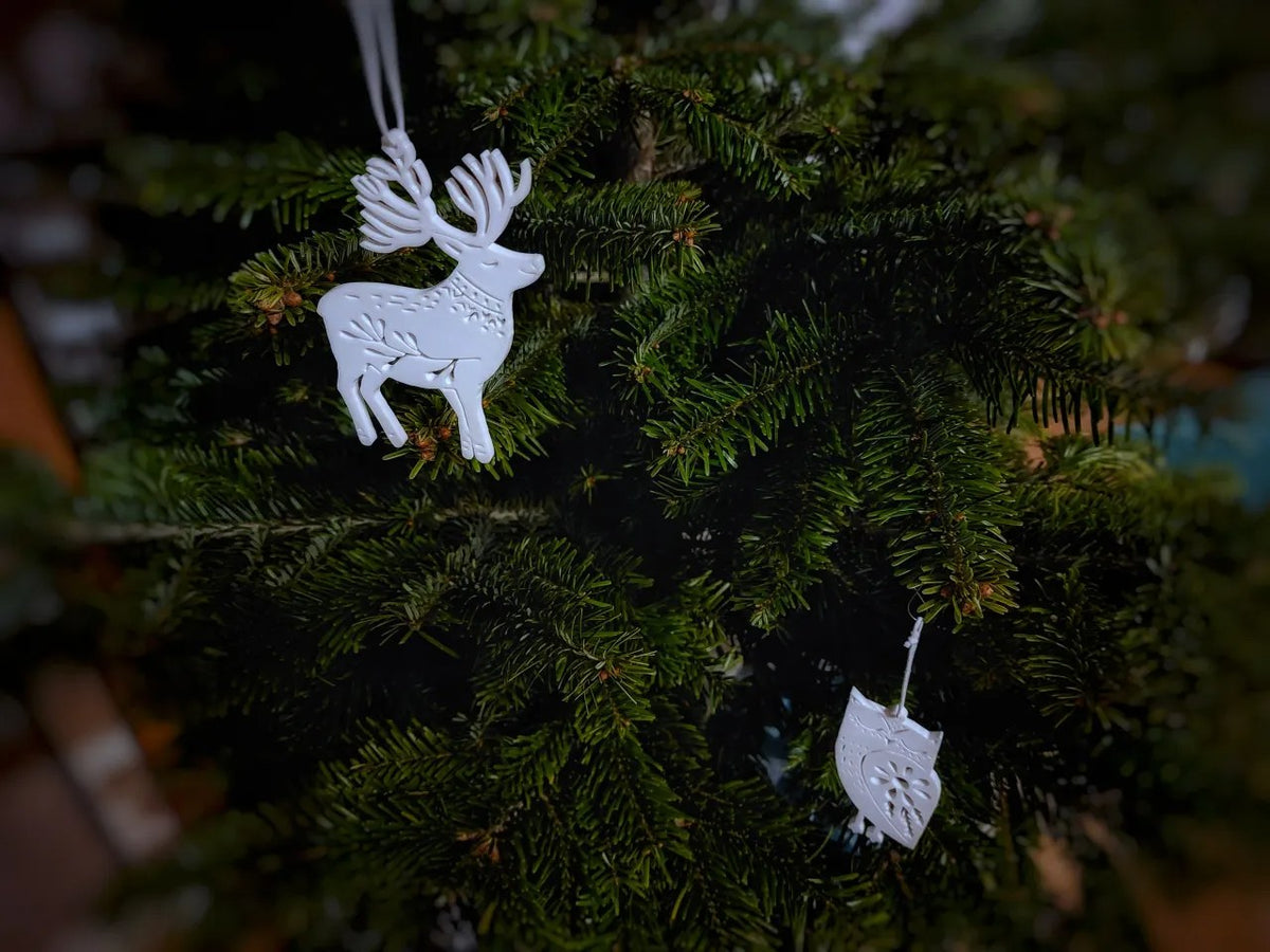 Acht kerstboomversieringen in de vorm van dieren