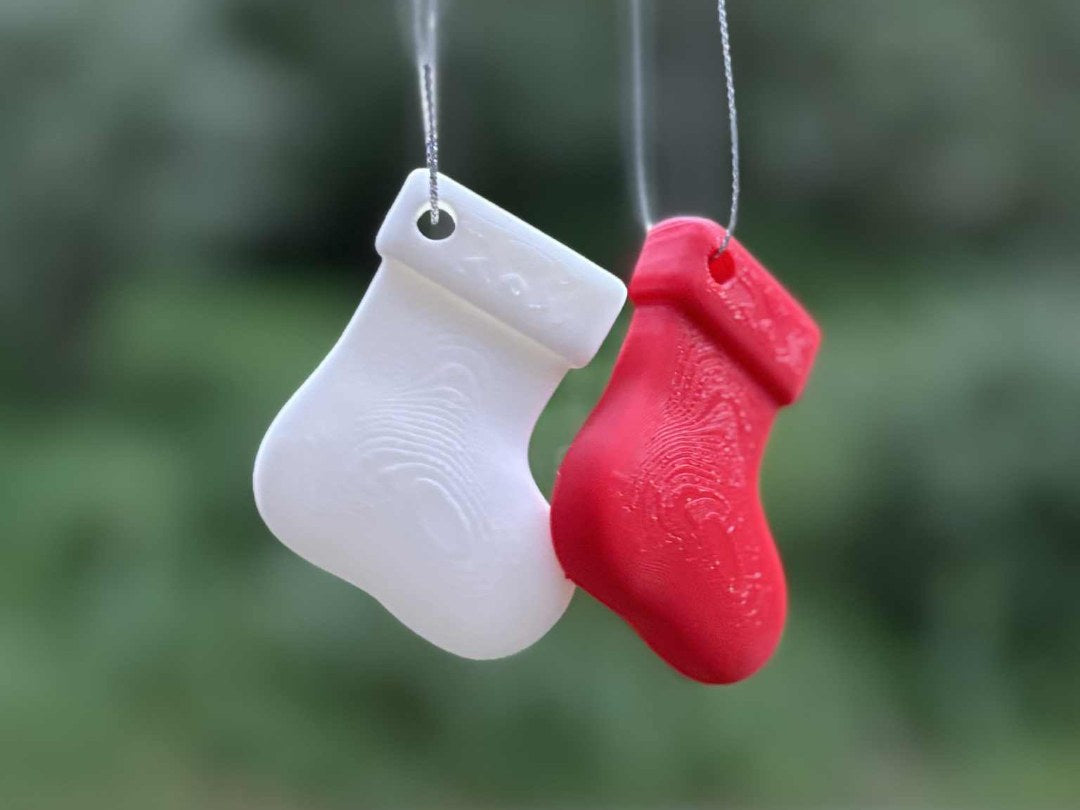 Kleine kerstsok als kerstboomversiering met ophanglusje