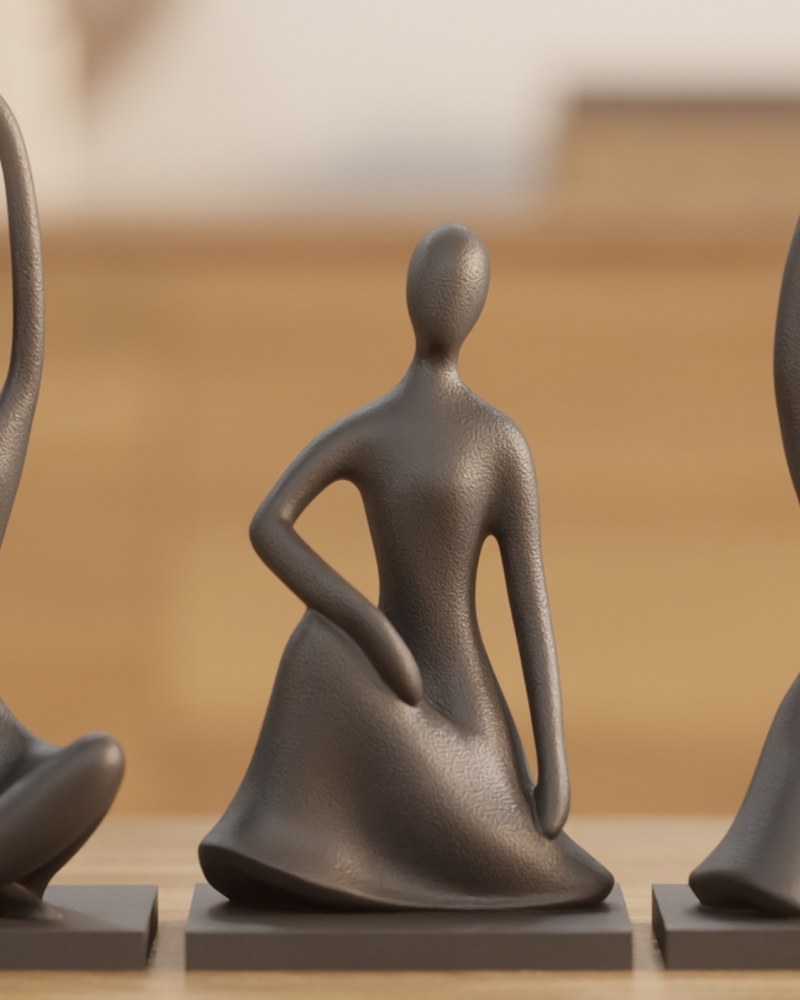 Drie abstracte mensfiguren met matte afwerking bij elkaar op een wit oppervlak