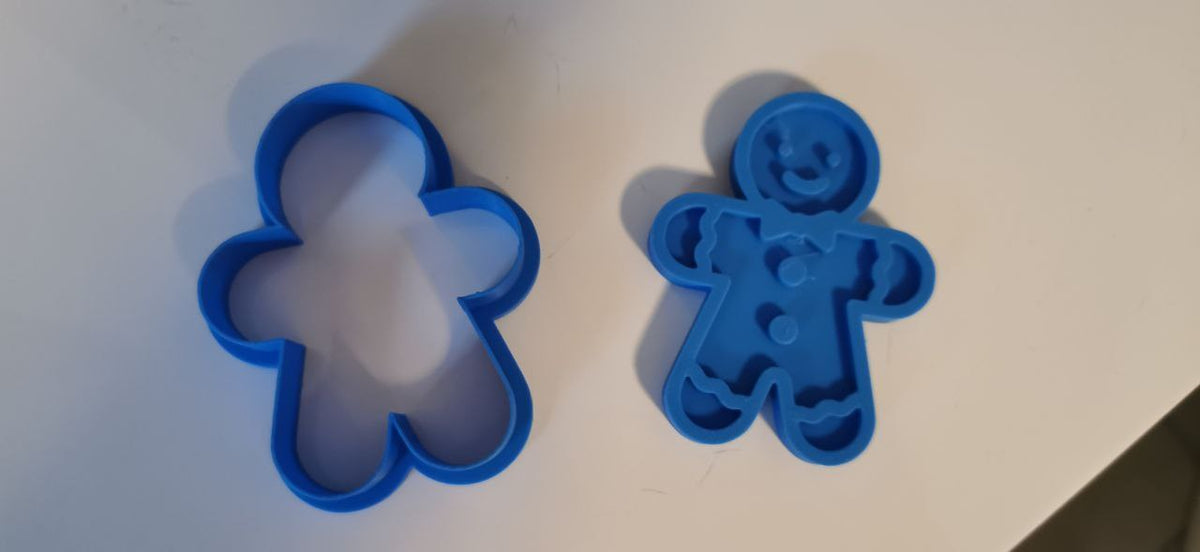Koekjesuitsteekvorm en stempel in de vorm van een peperkoekmannetje