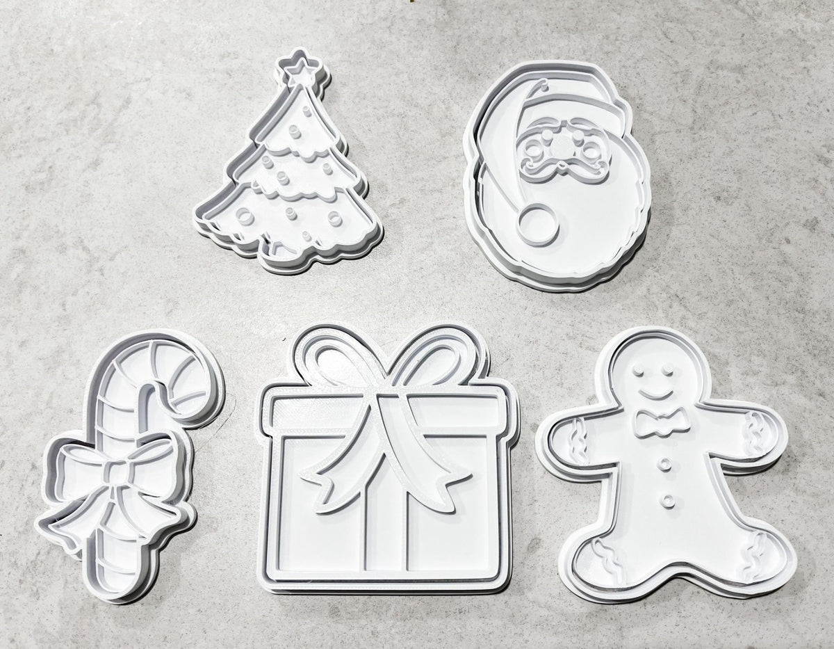 Koekjesuitsteekvormen en stempels met kerstmotieven