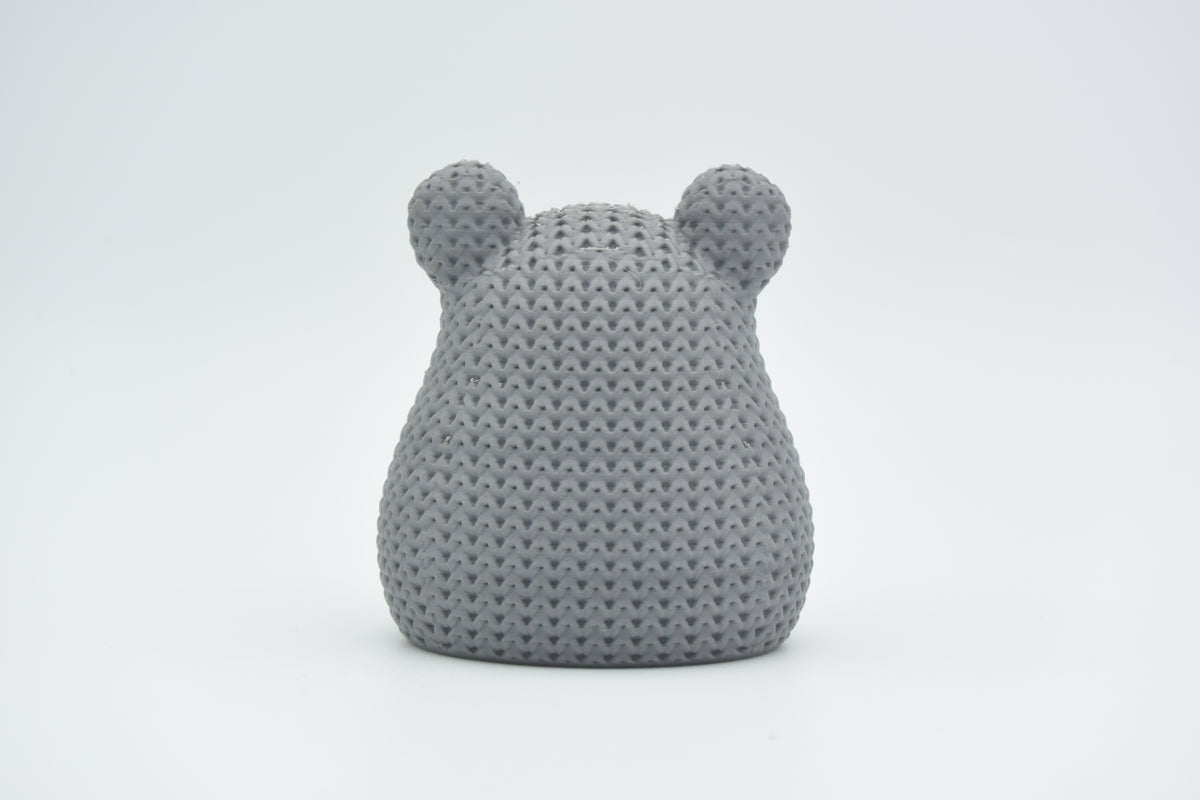 Detail van de structuur van de gebreide hamster met dicht gehaakt steekpatroon op de rug
