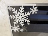 Sneeuwvlok als kerstdecoratie voor deur en raam