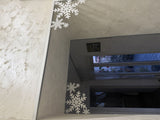 Sneeuwvlok als kerstdecoratie voor deur en raam